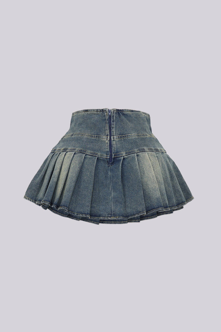 Top Tucked Into Pleated Denim Skirt