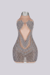 Sleeveless halter mini dress with an illusion nude mesh paneling with rhinestone accents