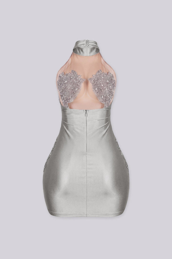Sleeveless halter mini dress with an illusion nude mesh paneling with rhinestone accents
