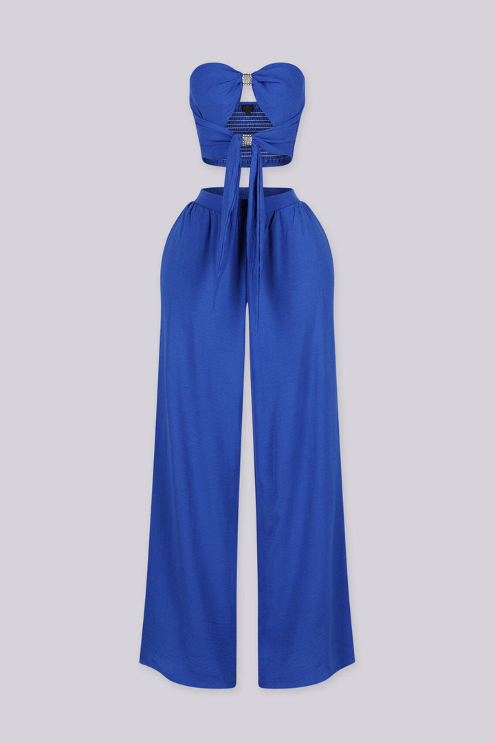 Chiffon tube top featuring central front cutout detailing with rhinestone buckle accent
Matching high waist wide leg pants with elastic waistband