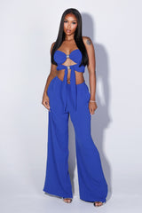 Chiffon tube top featuring central front cutout detailing with rhinestone buckle accent
Matching high waist wide leg pants with elastic waistband
