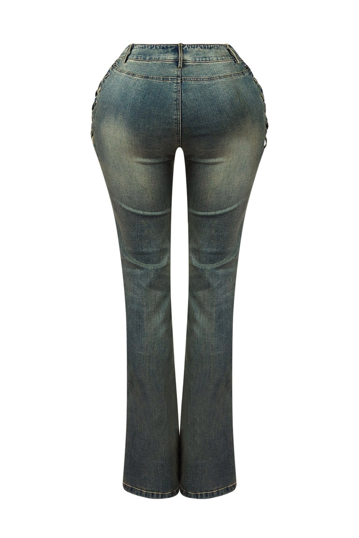 High rise vintage wash denim jeans featuring lace up details at center and outer hip sides