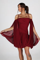 Sheer mesh mini dress with thin straps featuring oversized bishop sleeves balloon out from the shoulder