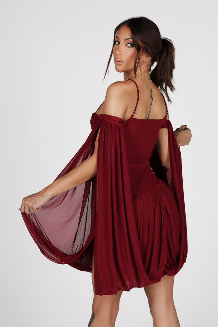 Sheer mesh mini dress with thin straps featuring oversized bishop sleeves balloon out from the shoulder