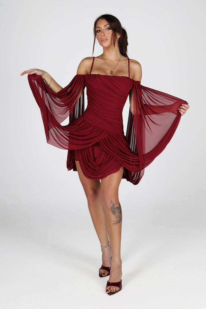Sheer mesh mini dress with thin straps featuring oversized bishop sleeves balloon out from the shoulder