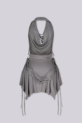 High drape halter mini dress with deep plunging cowl neckline
Layering of knotted fabric ropes cascading down the front with asymmetric handkerchief hemline