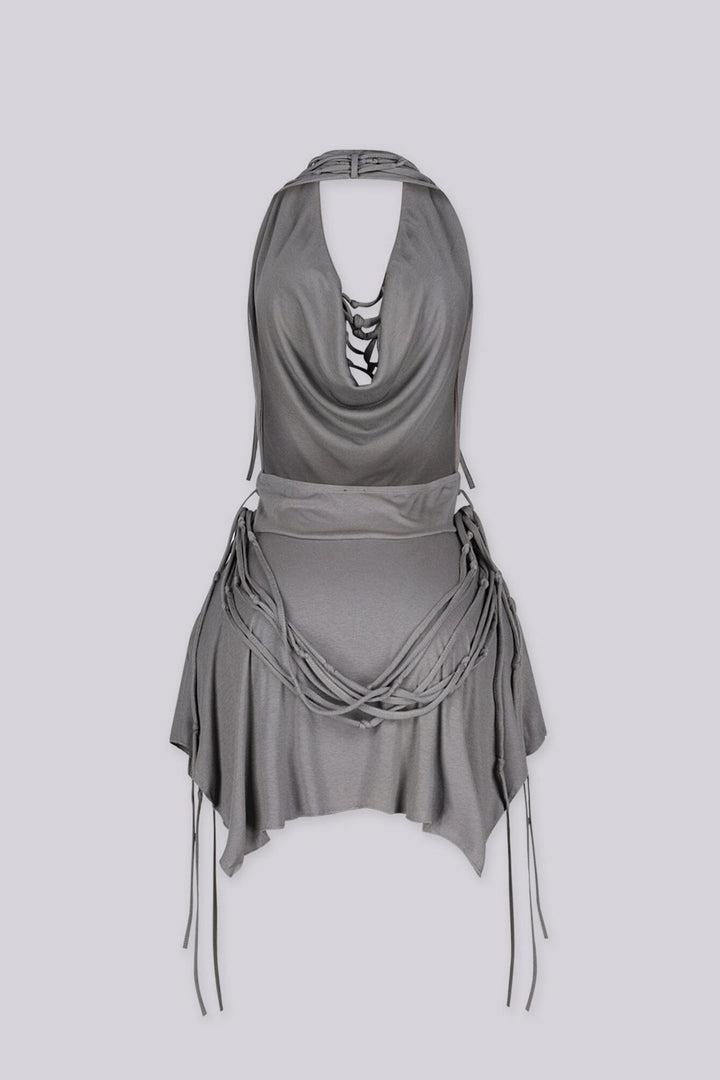 High drape halter mini dress with deep plunging cowl neckline
Layering of knotted fabric ropes cascading down the front with asymmetric handkerchief hemline