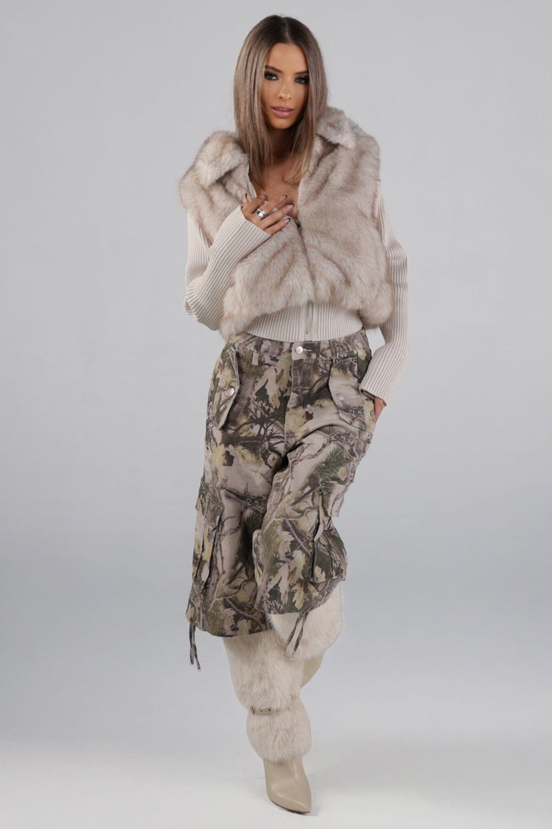 Soft faux fur full length collared jacket with ribbed long sleeve knit contrast and elastic knit hem
