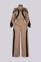 Zip front utility jumpsuit featuring contrast panel detailing at the chest and legs
Finished with a fixed waist detail and a long wide-leg fit