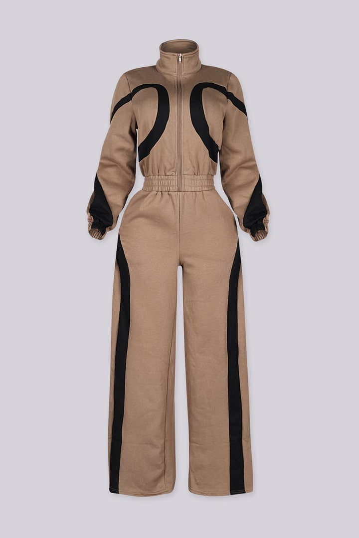 Zip front utility jumpsuit featuring contrast panel detailing at the chest and legs
Finished with a fixed waist detail and a long wide-leg fit