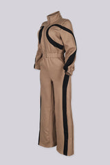 Zip front utility jumpsuit featuring contrast panel detailing at the chest and legs
Finished with a fixed waist detail and a long wide-leg fit