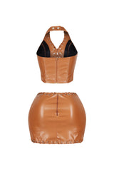 Stretched faux leather halter top featuring lace up with snap button closure
Matching high waisted faux leather mini skirt with lace up trim and back zip closure