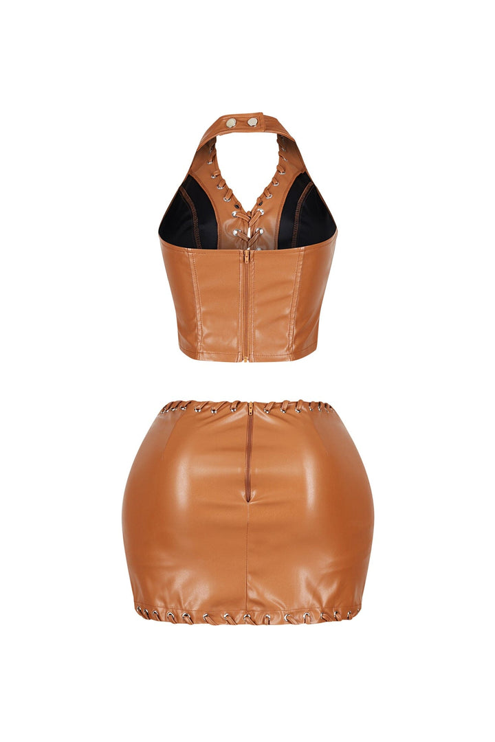 Stretched faux leather halter top featuring lace up with snap button closure
Matching high waisted faux leather mini skirt with lace up trim and back zip closure