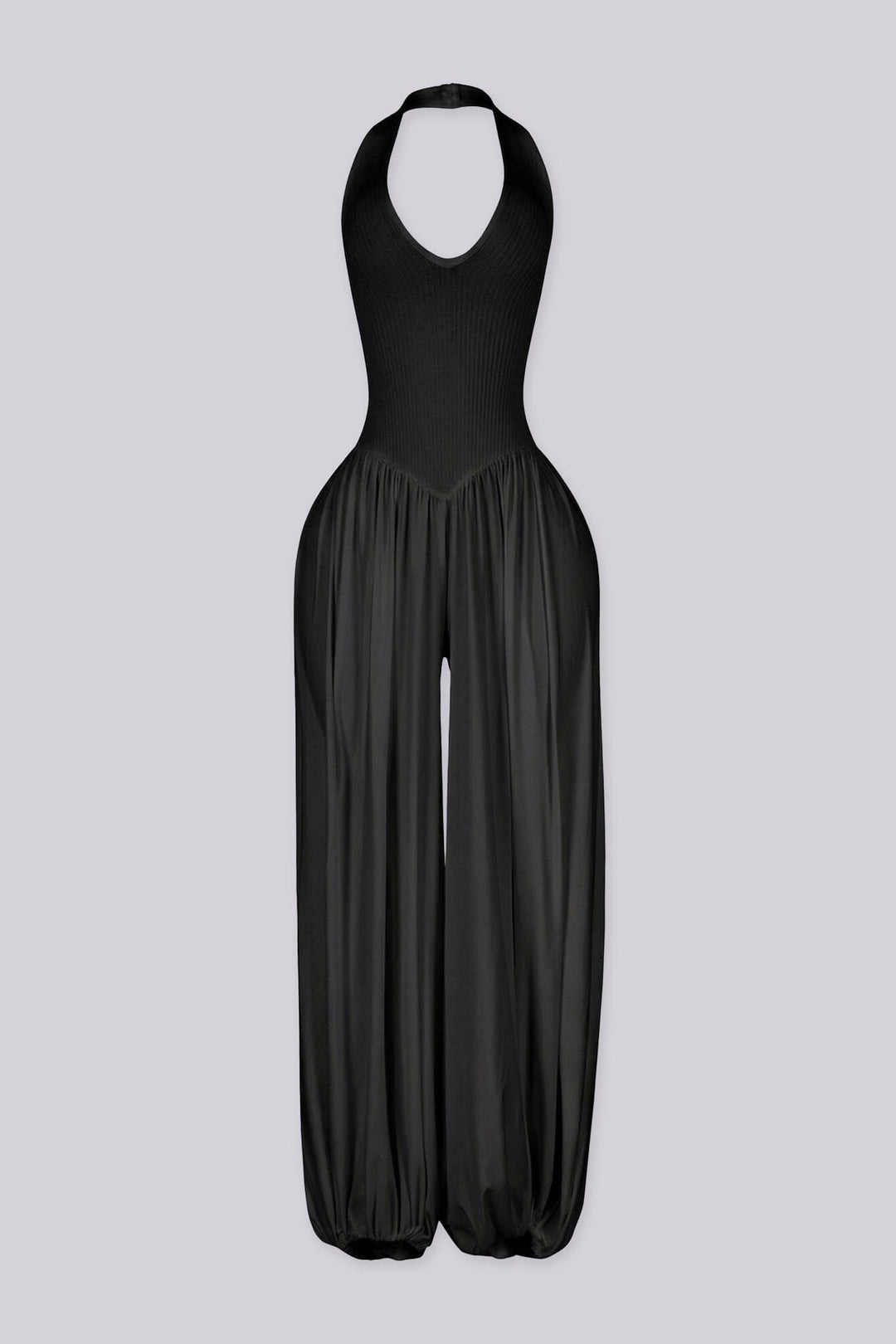 Ribbed knit halter neckline jumpsuit with voluminous balloon leg silhouette
Open back with lace-up closure