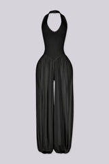 Ribbed knit halter neckline jumpsuit with voluminous balloon leg silhouette
Open back with lace-up closure