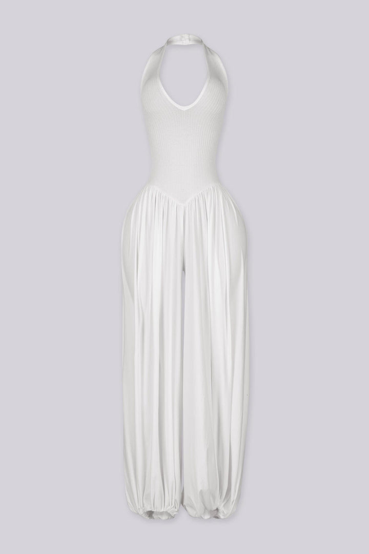 Ribbed knit halter neckline jumpsuit with voluminous balloon leg silhouette
Open back with lace-up closure