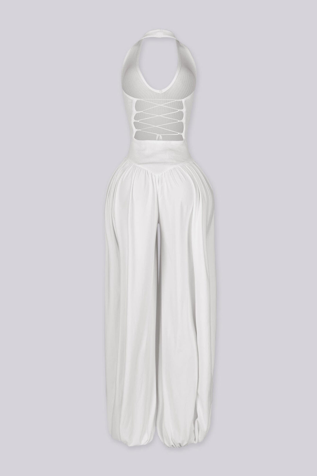 Ribbed knit halter neckline jumpsuit with voluminous balloon leg silhouette
Open back with lace-up closure