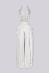 Ribbed knit halter neckline jumpsuit with voluminous balloon leg silhouette
Open back with lace-up closure