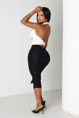 EDGE — black zip-slit capri pants, back view on model