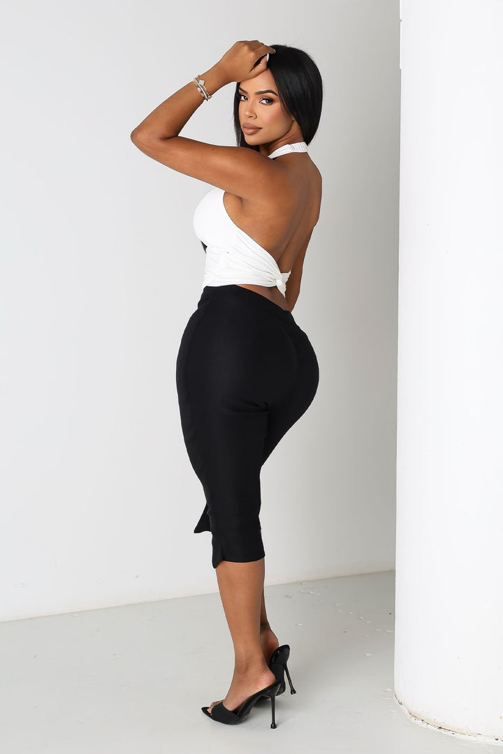 EDGE — black zip-slit capri pants, back view on model