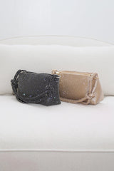 EDGE — black and gold rhinestone-embellished top handle evening bags shown side by side