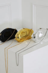 EDGE — black, gold, and silver mirror-plated mini clutches displayed together, flat lay