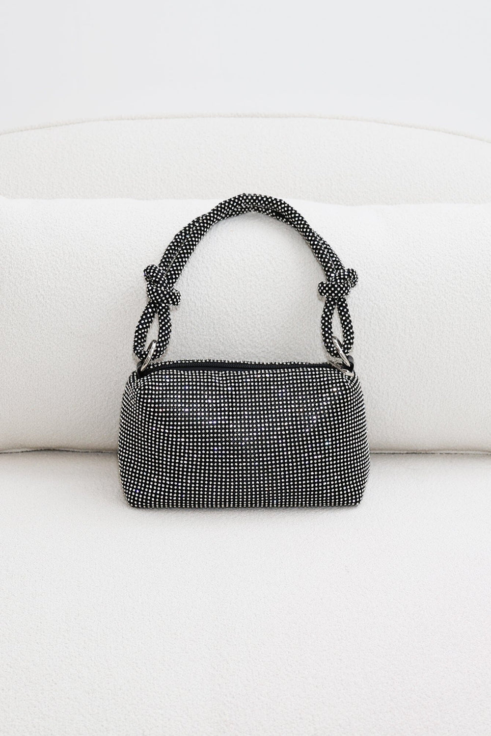 EDGE — black rhinestone-embellished top handle evening bag, front view flat lay