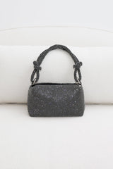 EDGE — black rhinestone-embellished top handle evening bag, front view flat lay