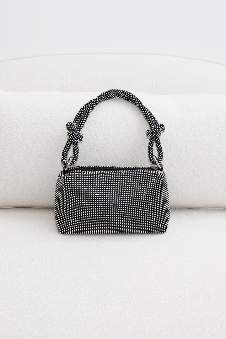 EDGE — black rhinestone-embellished top handle evening bag, front view flat lay