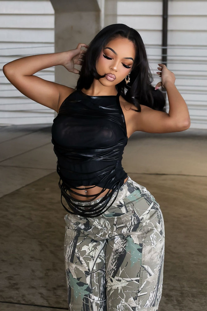 EDGE — black mesh faux leather wrap top, side view on model