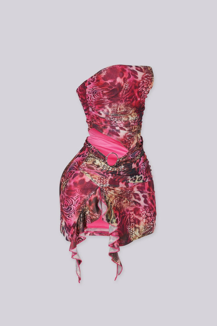 Sheer mesh tube mini dress with bold side cutout with metal ring detail
Asymmetric flowing hem creates a sculpted silhouette