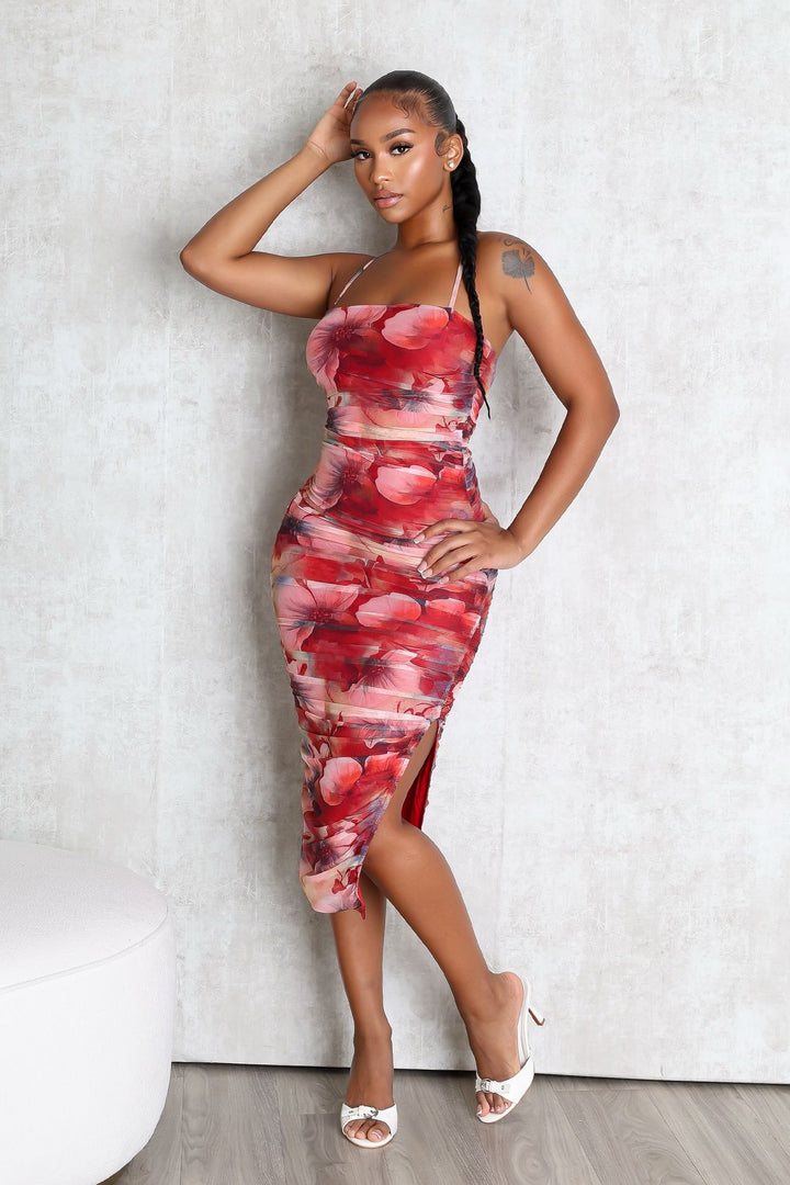 EDGE — red floral print ruched midi dress with a side slit, front view on model