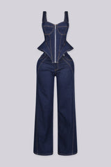 Denim bustier top with adjustable shoulder straps and vertical boning seams featuring peplum hem that flares at the hip