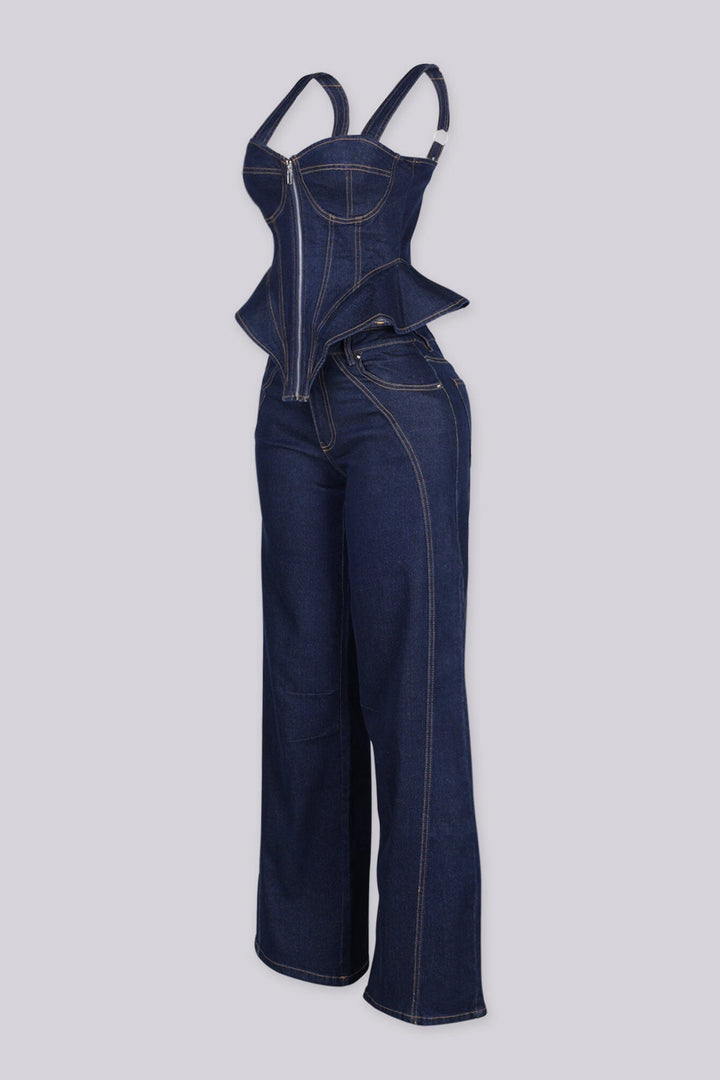 Denim bustier top with adjustable shoulder straps and vertical boning seams featuring peplum hem that flares at the hip