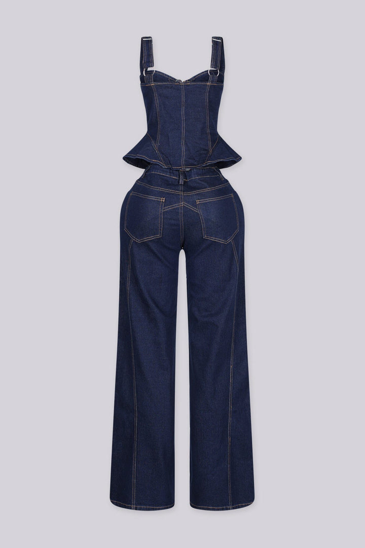 Denim bustier top with adjustable shoulder straps and vertical boning seams featuring peplum hem that flares at the hip