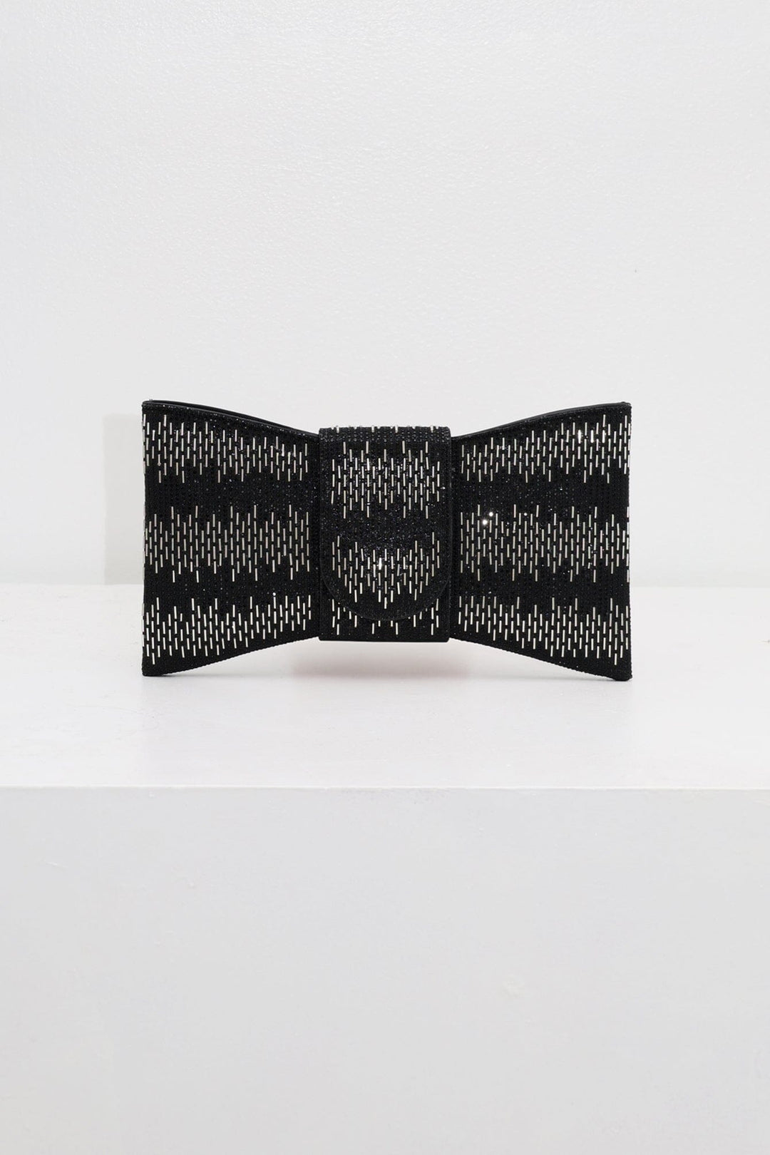 EDGE — black rhinestone bow-shaped evening clutch, front view flat lay