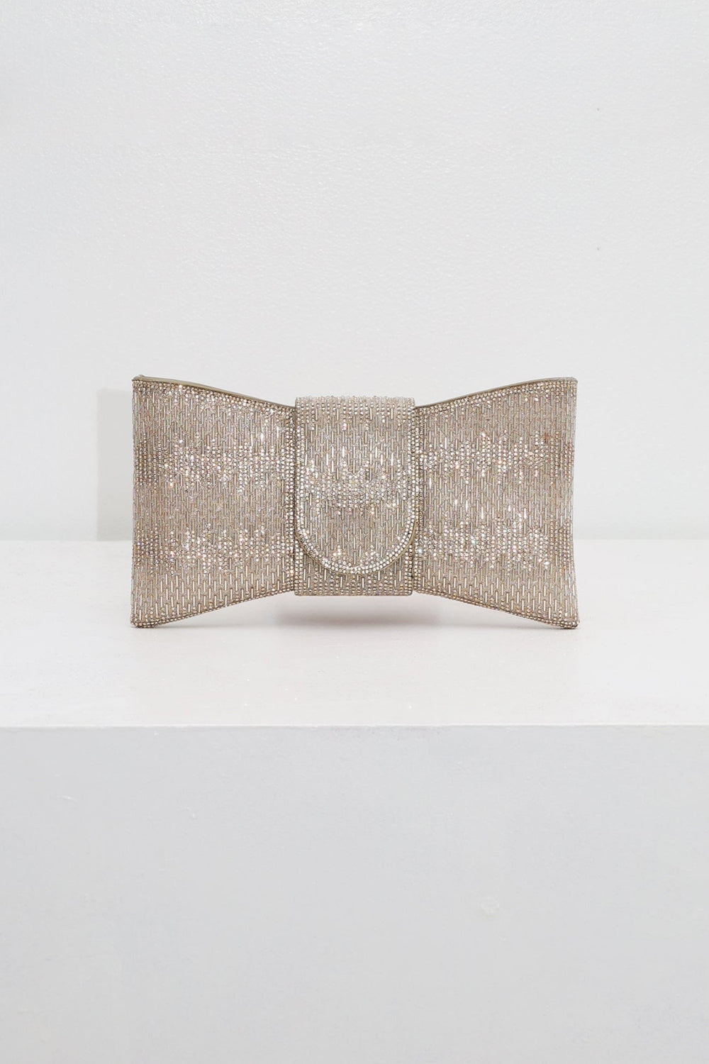EDGE — gold rhinestone bow-shaped evening clutch, front view flat lay