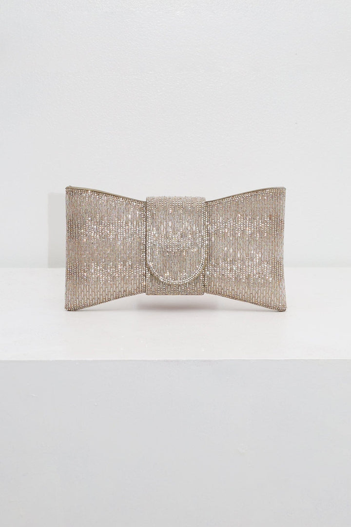EDGE — gold rhinestone bow-shaped evening clutch, front view flat lay