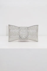 EDGE — silver rhinestone bow-shaped evening clutch, front view flat lay