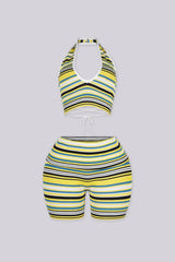 Plunging V-neck halter crop top with open back secured by an adjustable criss-cross lace-up tie closure
Matching mid-length biker shorts designed with adjustable fold-over waistband