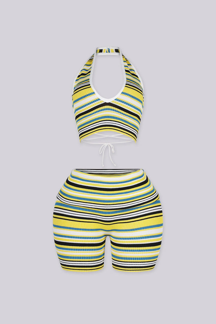Plunging V-neck halter crop top with open back secured by an adjustable criss-cross lace-up tie closure
Matching mid-length biker shorts designed with adjustable fold-over waistband