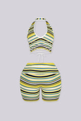 Plunging V-neck halter crop top with open back secured by an adjustable criss-cross lace-up tie closure
Matching mid-length biker shorts designed with adjustable fold-over waistband