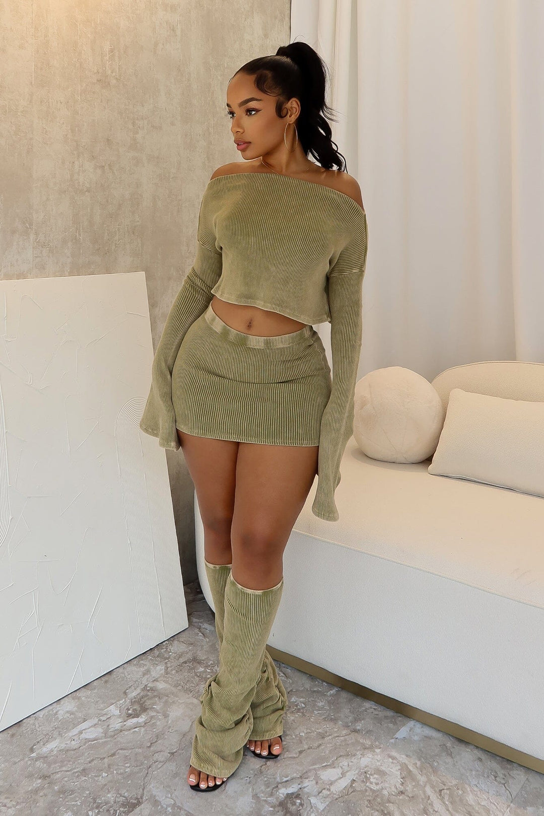 Mineral washed ribbed knit long sleeve crop top featuring asymmetrical neckline, Matching low rise skirt and leg warmers