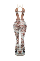 Mesh sleeveless jumpsuit with deep plunging front featuring keyhole chest with cascading ruffle trim detail