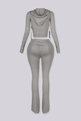 Cropped zip up knit hoodie with a drawstring hood featuring elongated slim sleeves and waist