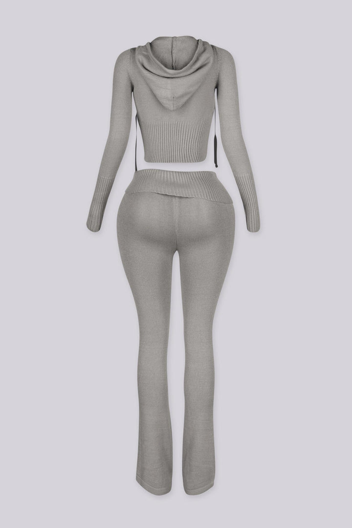 Cropped zip up knit hoodie with a drawstring hood featuring elongated slim sleeves and waist