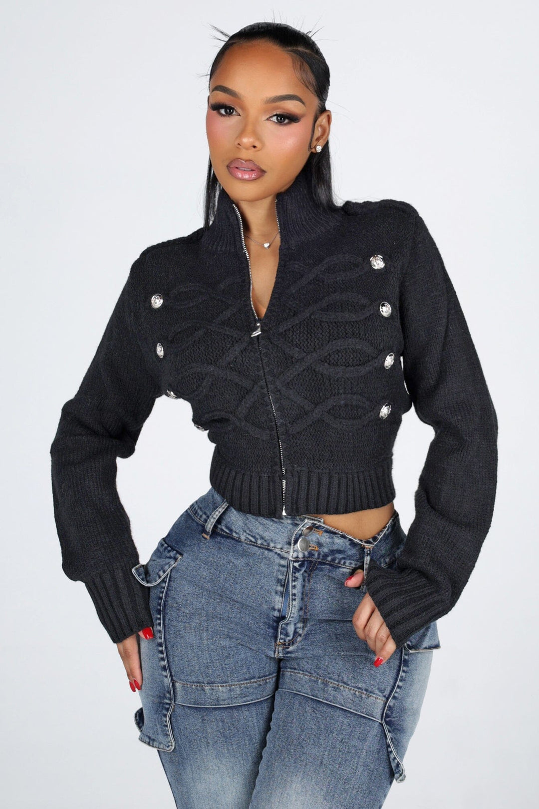 Cropped cable knit cardigan with a mock collar featuring epaulet shoulder detail and crest button trim