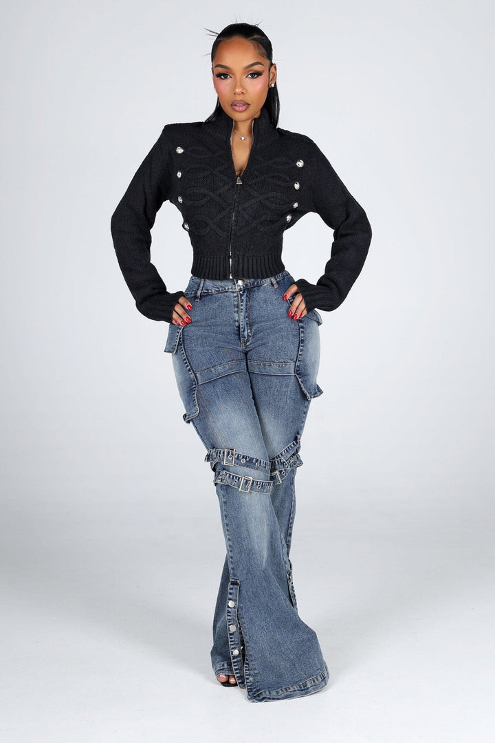 Cropped cable knit cardigan with a mock collar featuring epaulet shoulder detail and crest button trim