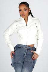 Cropped cable knit cardigan with a mock collar featuring epaulet shoulder detail and crest button trim