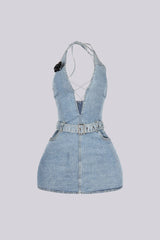 Washed denim halter mini dress with deep plunging V neck featuring center cutout with criss cross lace up detail